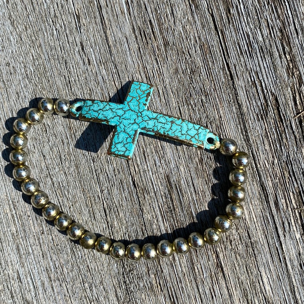 Bracelet with metal distressed cross